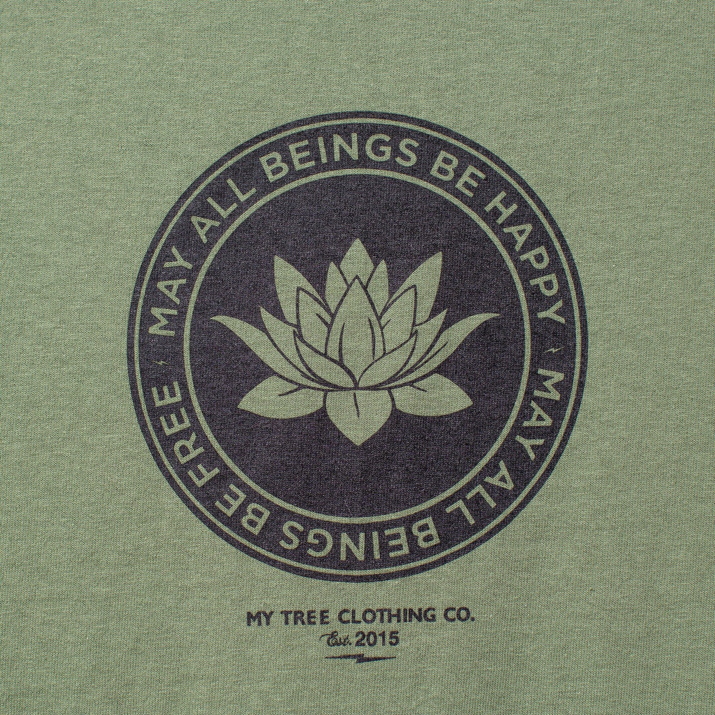 Green t-shirt with lotus flower design and text on a green background.