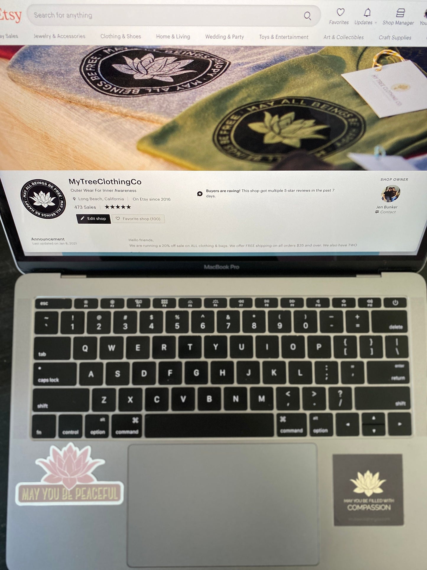 Laptop displaying a website with 'MyTreeClothingCo' branding.