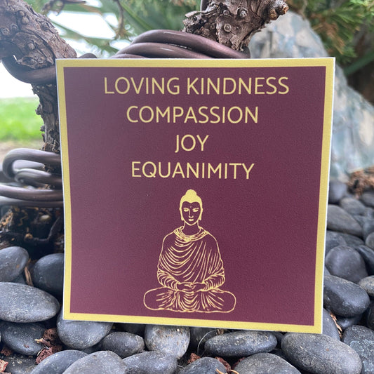Tibetan red and gold three inch sticker with 'Loving Kindness, Compassion, Joy, Equanimity' text and a Buddha illustration on pebbles.