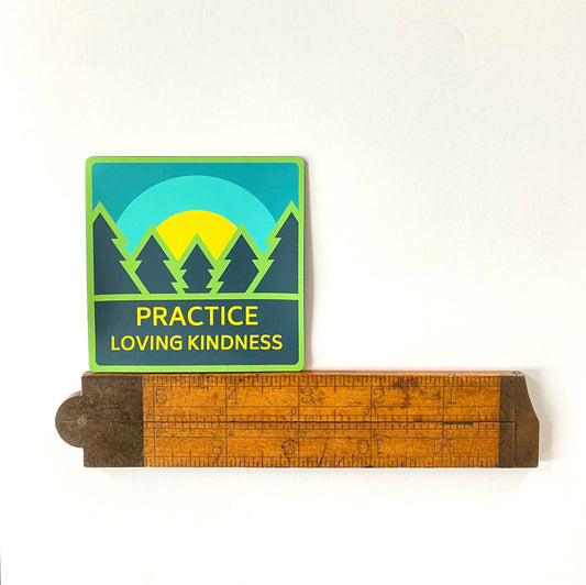 Sticker with nature design and 'Practice Loving Kindness' text on a white background