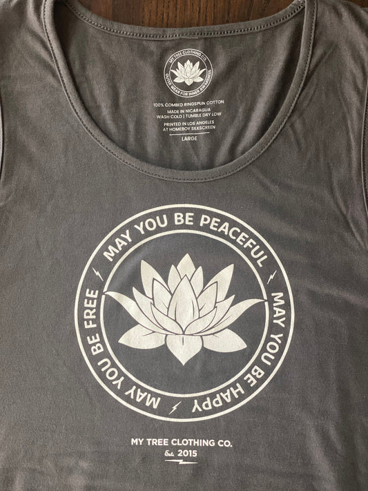 Close up of gray tank top with a lotus and the text, MAY YOU BE PEACEFUL MAY YOU BE HAPPY MAY YOU BE FREE.