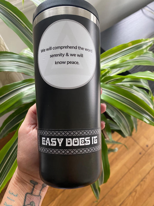Black tumbler with rectangular black and white 'Easy Does It' sticker.